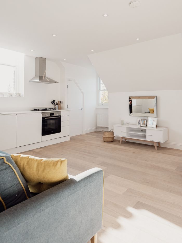 about-us Spacious and cozy living area with modern style and natural light.
